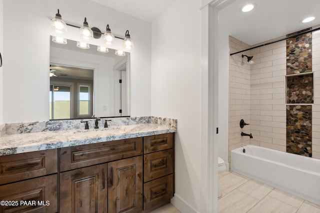 full bathroom featuring vanity, bathing tub / shower combination, and toilet