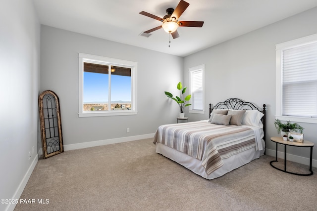 bedroom featuring carpet, baseboards, visible vents, and a ceiling fan