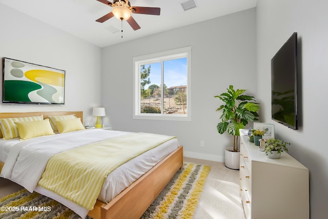 bedroom with visible vents, baseboards, carpet, and ceiling fan