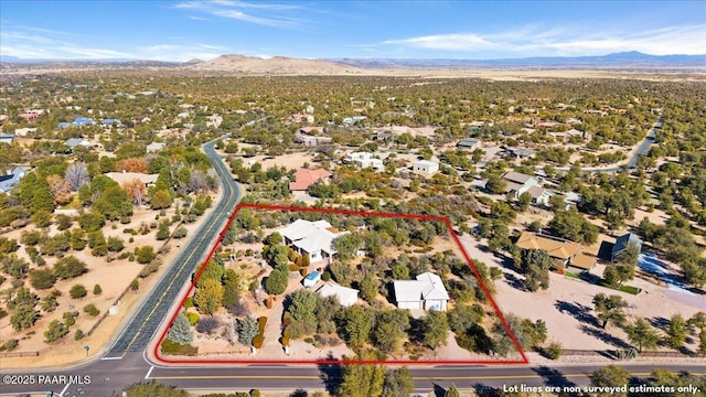 birds eye view of property with a mountain view