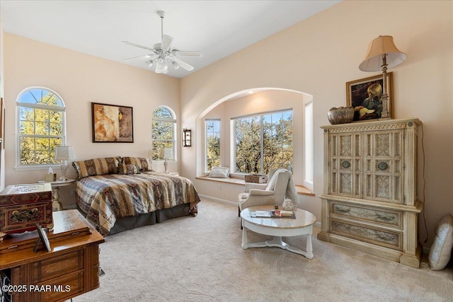 bedroom with a ceiling fan and carpet