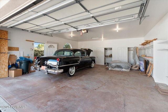 garage featuring a garage door opener