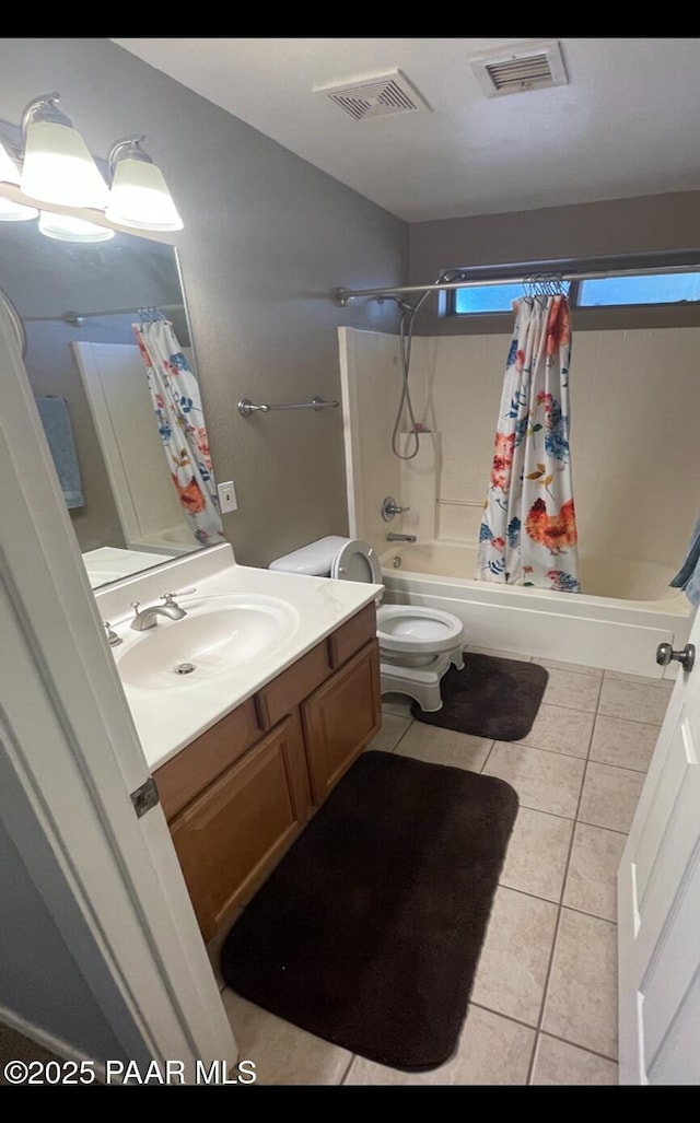 full bathroom with tile patterned flooring, vanity, toilet, and shower / bathtub combination with curtain