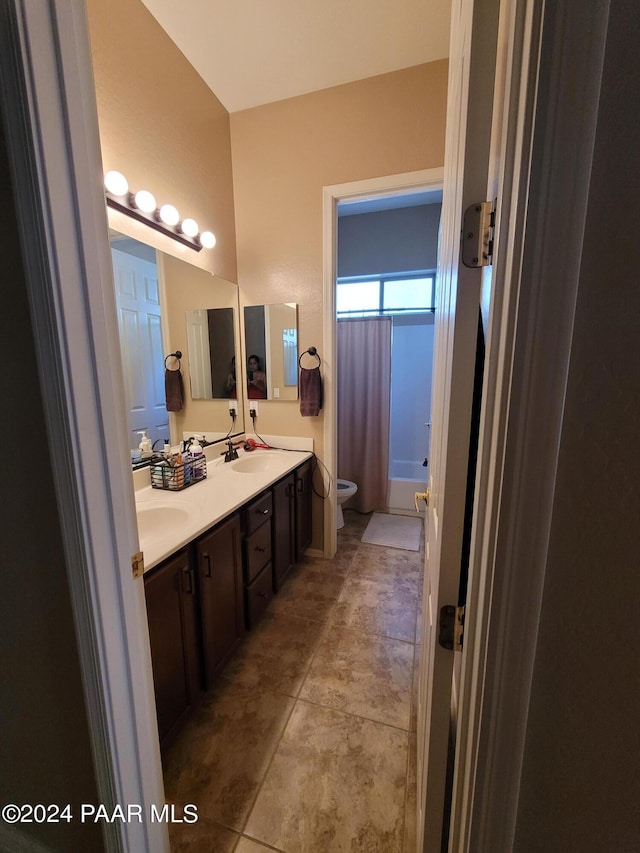 full bathroom with tile patterned flooring, vanity, toilet, and shower / tub combo with curtain