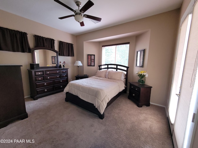 carpeted bedroom with ceiling fan