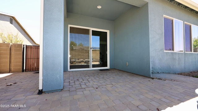 view of patio / terrace featuring fence