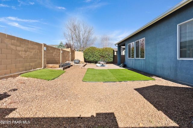 view of yard featuring a fenced backyard and a patio area