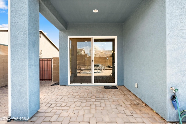 view of patio / terrace featuring fence