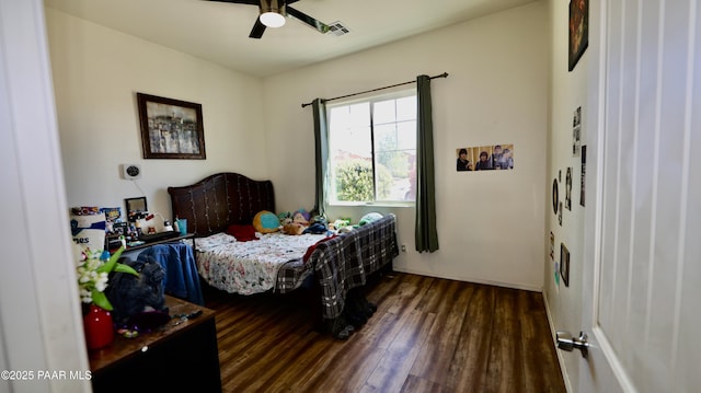 bedroom with visible vents, wood finished floors, and ceiling fan