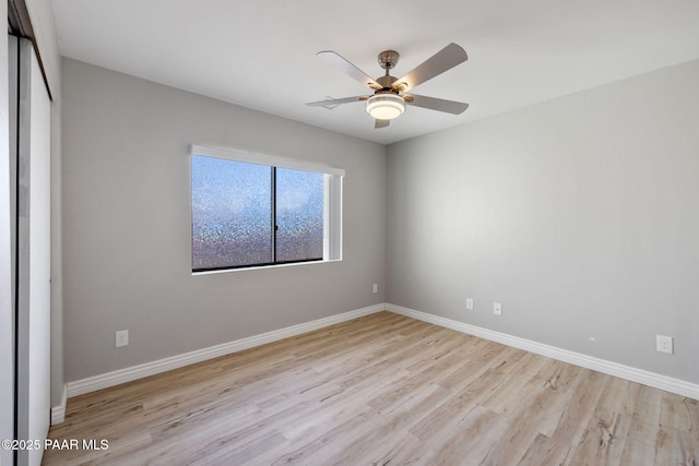 spare room featuring ceiling fan and light hardwood / wood-style floors