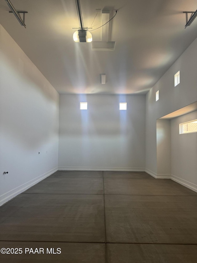 unfurnished room featuring baseboards