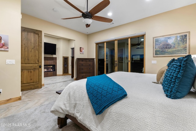 bedroom with ceiling fan and light parquet flooring