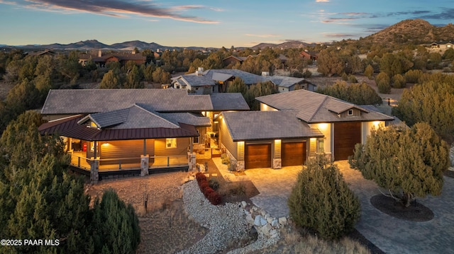 view of front of house featuring a garage and a mountain view