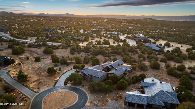 aerial view at dusk with a mountain view