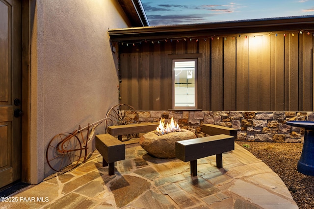 exterior space featuring an outdoor fire pit