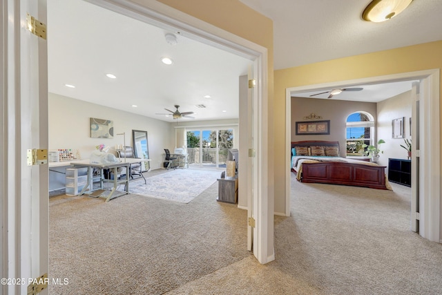 hallway featuring light colored carpet