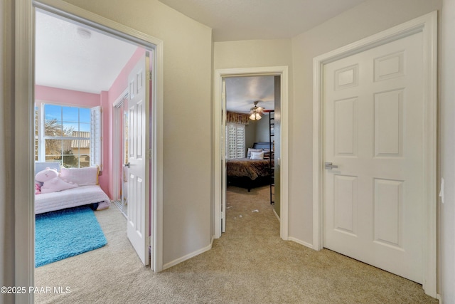 hallway with light carpet