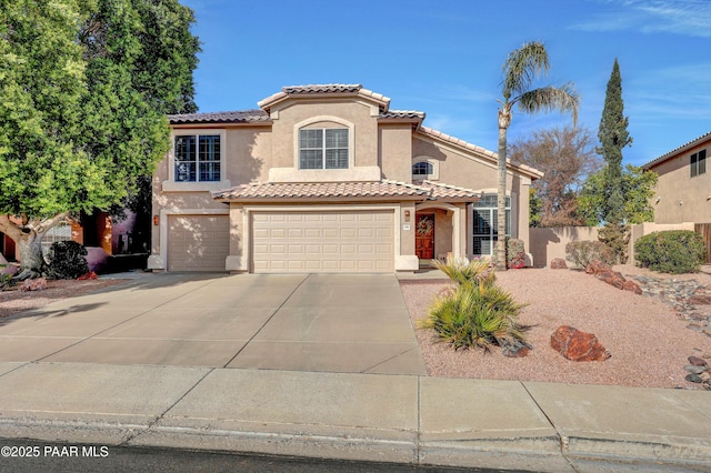 mediterranean / spanish-style house featuring a garage