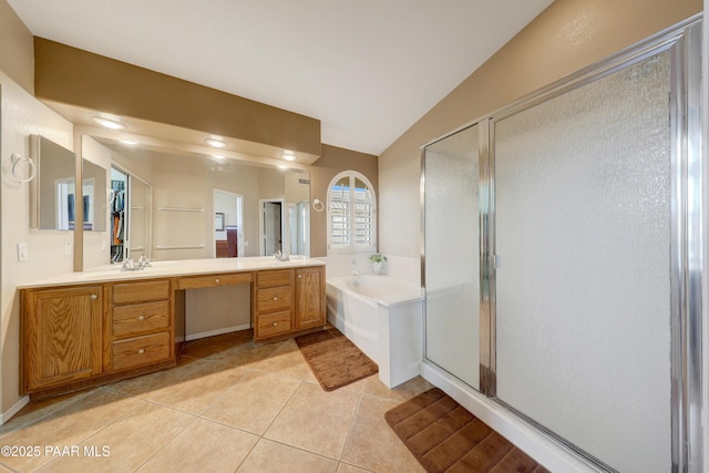 bathroom with tile patterned flooring, plus walk in shower, lofted ceiling, and vanity