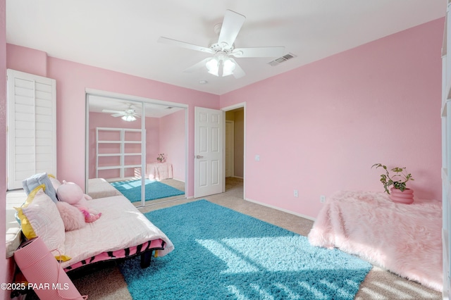 bedroom featuring ceiling fan and light carpet