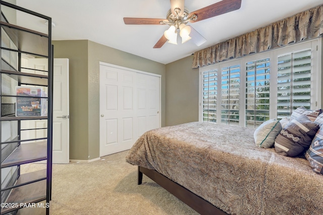 carpeted bedroom featuring ceiling fan