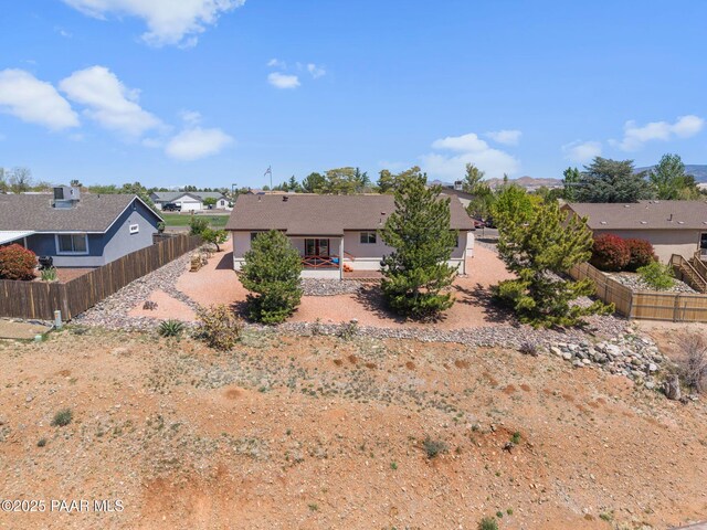 9341 E Manzanita Cir, Prescott Valley, AZ 86314 - view of front of house with a patio, fence, and a residential view
