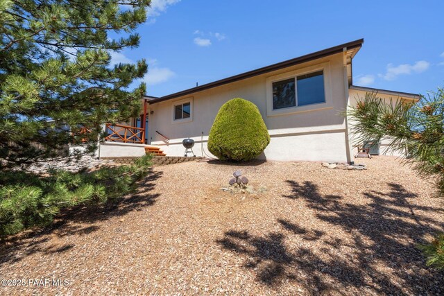 9341 E Manzanita Cir, Prescott Valley, AZ 86314 - rear view of house featuring stucco siding