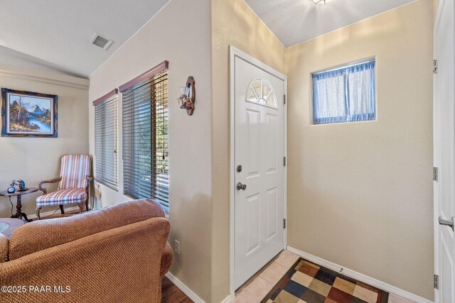 9341 E Manzanita Cir, Prescott Valley, AZ 86314 - entryway with visible vents, baseboards, and vaulted ceiling