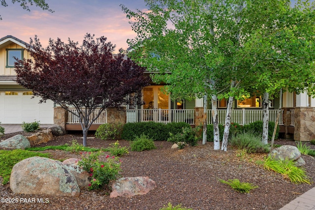 2469 W Post Oak Dr, Prescott, AZ 86305 - obstructed view of property featuring stone siding, covered porch, and board and batten siding
