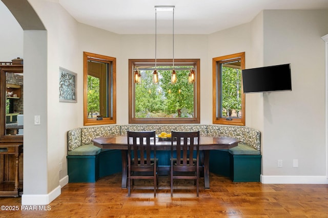2469 W Post Oak Dr, Prescott, AZ 86305 - dining area with breakfast area, wood finished floors, and arched walkways