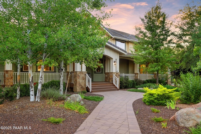 2469 W Post Oak Dr, Prescott, AZ 86305 - view of front of house featuring a porch and stone siding