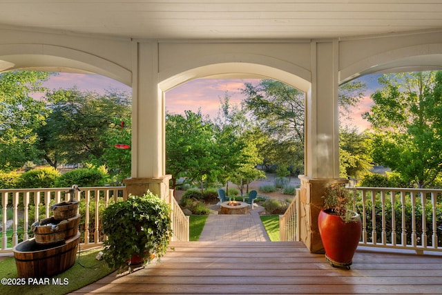 2469 W Post Oak Dr, Prescott, AZ 86305 - deck at dusk with a porch and an outdoor fire pit