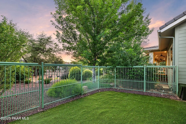 2469 W Post Oak Dr, Prescott, AZ 86305 - yard at dusk with a fenced backyard