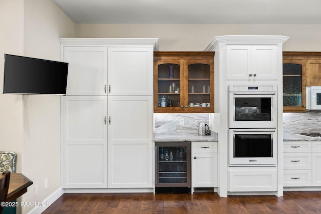2469 W Post Oak Dr, Prescott, AZ 86305 - indoor dry bar featuring wine cooler, white appliances, dark wood-style flooring, and tasteful backsplash