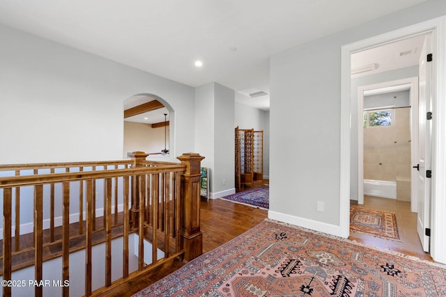 2469 W Post Oak Dr, Prescott, AZ 86305 - hallway featuring an upstairs landing, wood finished floors, arched walkways, and recessed lighting