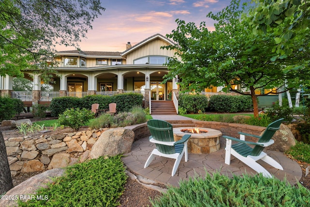 2469 W Post Oak Dr, Prescott, AZ 86305 - back of house featuring a fire pit, a porch, and a chimney