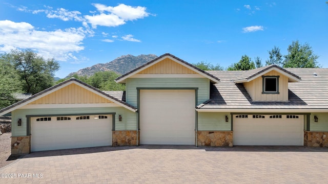 2469 W Post Oak Dr, Prescott, AZ 86305 - craftsman inspired home with stone siding, a mountain view, board and batten siding, and an attached garage