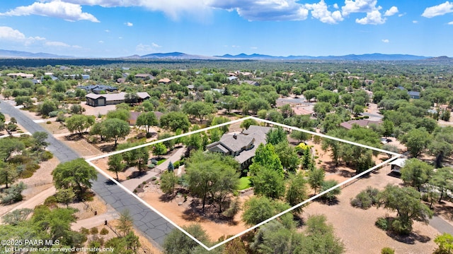 2469 W Post Oak Dr, Prescott, AZ 86305 - aerial overview of property's location featuring a mountainous background and property boundaries highlighted