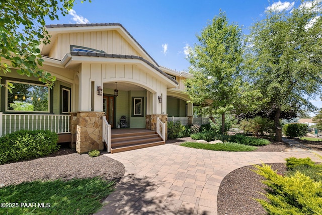 2469 W Post Oak Dr, Prescott, AZ 86305 - craftsman-style house featuring a porch, stone siding, and board and batten siding