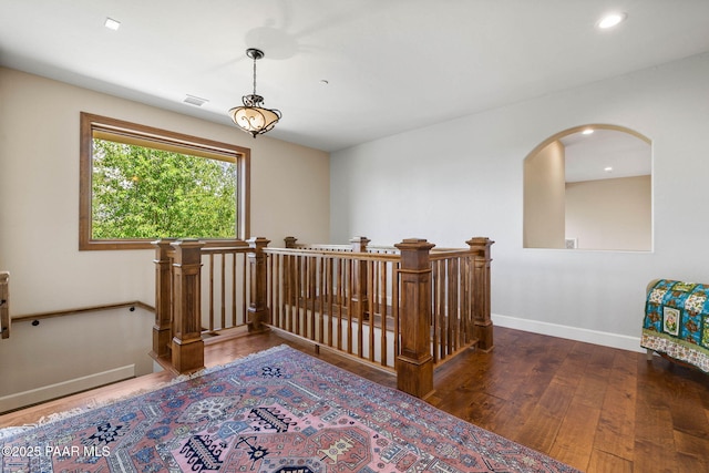 2469 W Post Oak Dr, Prescott, AZ 86305 - hall with an upstairs landing, wood finished floors, arched walkways, and recessed lighting