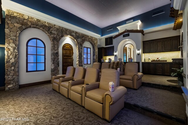 home theater with a towering ceiling