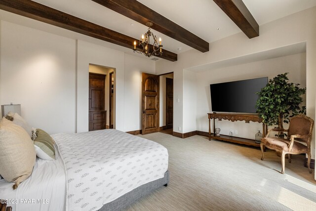 carpeted bedroom featuring beamed ceiling and an inviting chandelier