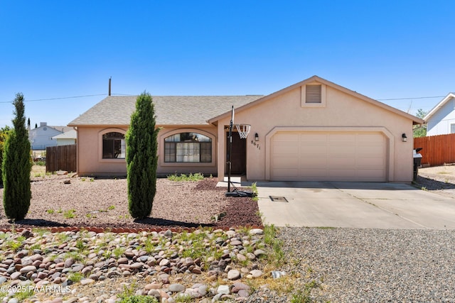 8671 E Apache Dr, Prescott Valley, AZ 86314 - ranch-style house featuring driveway, a garage, and stucco siding