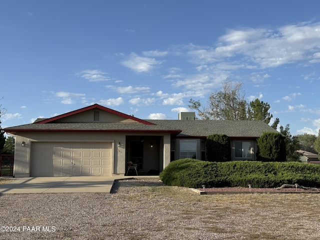 single story home with a garage