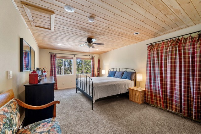 carpeted bedroom with ceiling fan and wooden ceiling