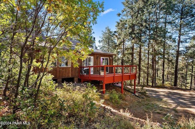 back of house featuring a deck