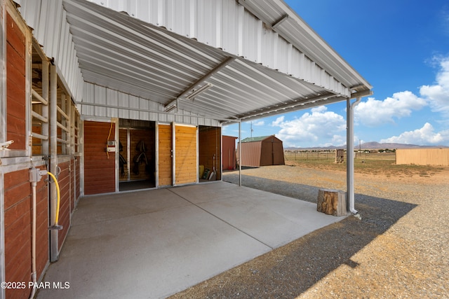 view of patio featuring an exterior structure and an outdoor structure