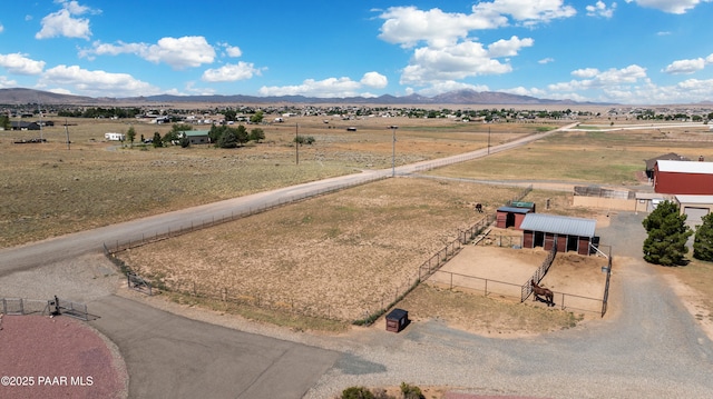 birds eye view of property with a rural view and a mountain view