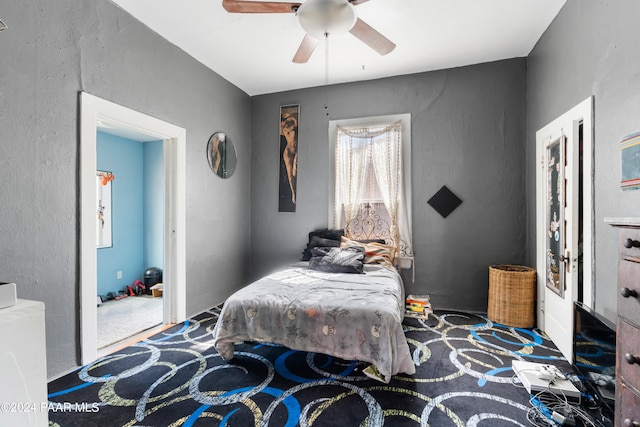 carpeted bedroom with ceiling fan