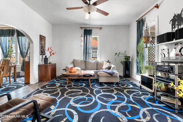 living room with ceiling fan and wood-type flooring